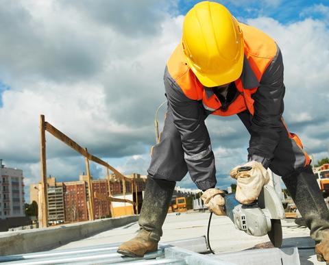 Builder standing on an active work site.
